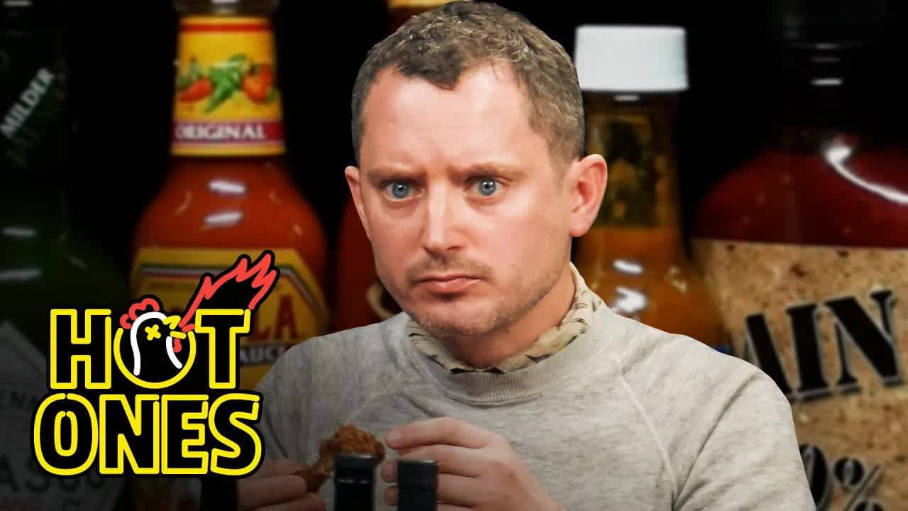 Elijah Wood Tastes the Lava of Mount Doom While Eating Spicy Wings still
