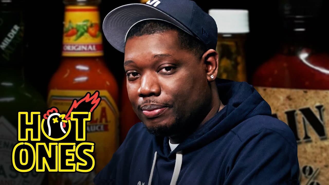 Michael Che Gs Up While Eating Spicy Wings still